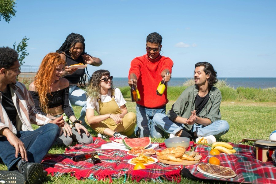 A big group picnic by the water